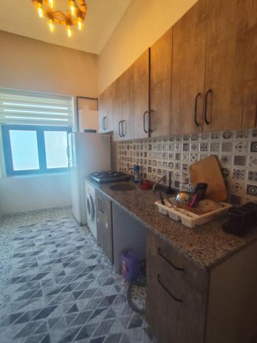 a kitchen with a refrigerator and a counter top at Yörük konaklama in Burdur