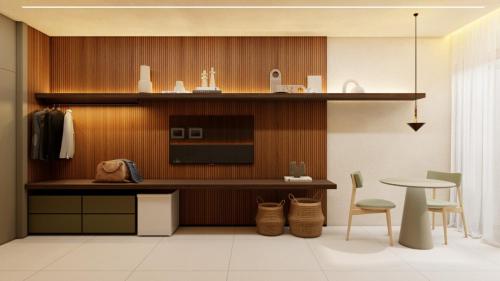 a kitchen with a counter and a table and chairs at Verde da Mata Hotel in Juazeiro do Norte