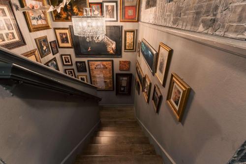 a hallway with a bunch of pictures on a wall at Stay at Hogwarts Harry Potter's Home, Free Parking, Pets Allowed in Kissimmee