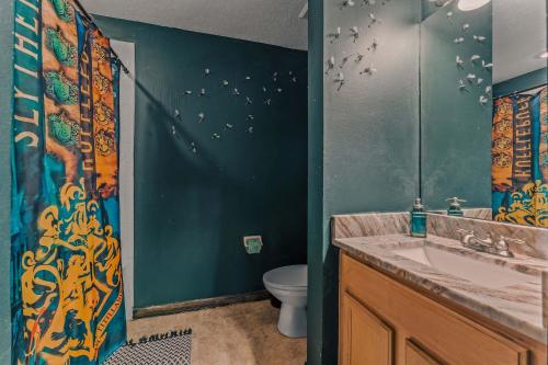 a bathroom with a sink and a toilet and a shower at Stay at Hogwarts Harry Potter's Home, Free Parking, Pets Allowed in Kissimmee
