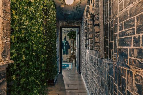 an alley way with plants on the walls at Stay at Hogwarts Harry Potter's Home, Free Parking, Pets Allowed in Kissimmee