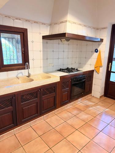 a kitchen with a sink and a stove at Son Rapinya Porto Cristo in Porto Cristo