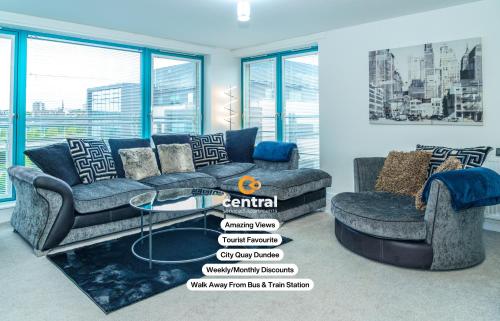 a living room with two couches and a glass table at City Quay by CENTRAL SERVICED APARTMENTS - 2 Bedrooms - City Quay Views - Walk Into Dundee City Centre - Walk Away From Bus & Train Station - Lift Access in Dundee
