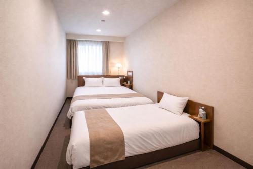 מיטה או מיטות בחדר ב-Erebuni Hotel