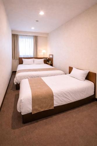 מיטה או מיטות בחדר ב-Erebuni Hotel