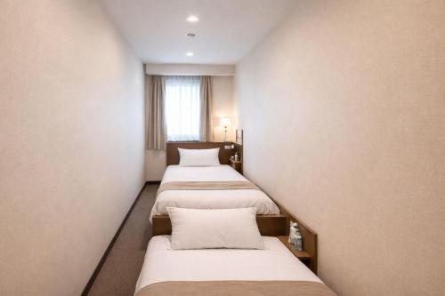 מיטה או מיטות בחדר ב-Erebuni Hotel