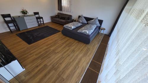 a living room with a couch and a table at Your Perfect Escape to Relax in Sipbachzell