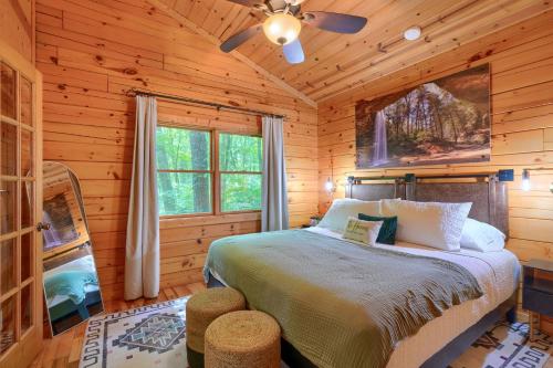 a bedroom with a bed in a log cabin at Havenridge in Logan