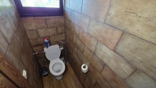 a small bathroom with a toilet in a tiled wall at Your Perfect Escape to Relax in Sipbachzell