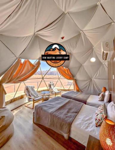 a room with a bed in a tent at RUM MARTiN BUBBLES lUXURY CAMP in Wadi Rum