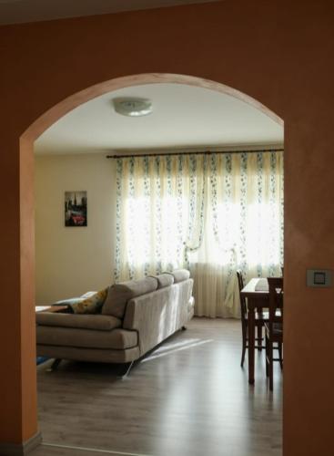 a living room with a couch and a table at Casa Sacchet a Longarone in Longarone