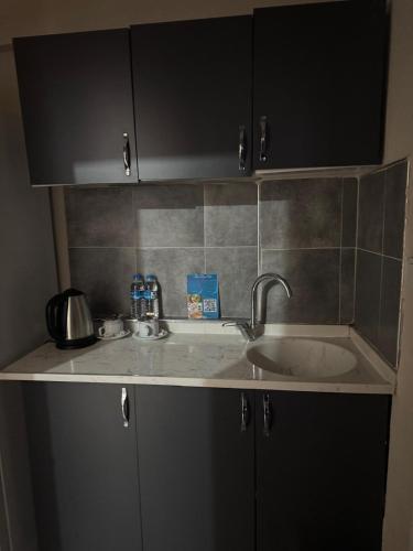 a kitchen counter top with a sink and a counter top at Blue class otel in Atakum