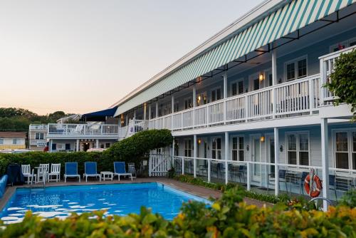 a hotel with a swimming pool in front of a building at The Edgewater in Old Orchard Beach