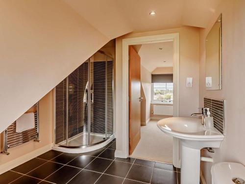 a bathroom with a sink and a shower and a toilet at 6 Bed in Morpeth oc-91805 in Ellington