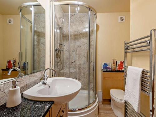 a bathroom with a sink and a shower at 2 Bed in Kirkby Stephen oc-sz144 in Kirkby Stephen