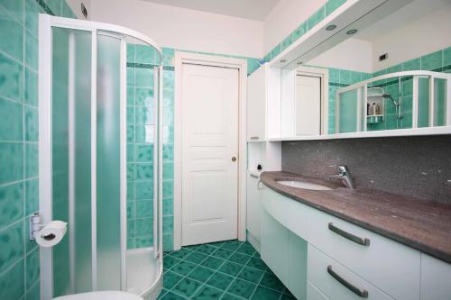 a bathroom with a toilet and a sink and a shower at WI-RO Carminati - Mare e relax in Marina di Andora