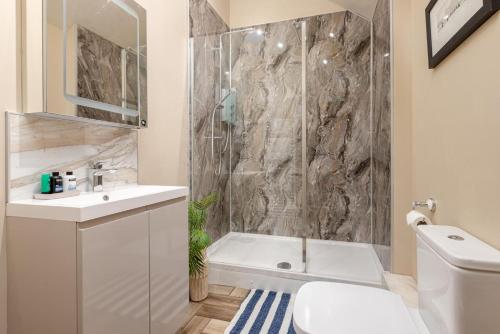 a bathroom with a tub and a sink and a toilet at 2 Bed in Wycliffe oc-r29947 in Wycliffe