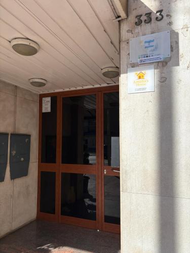 an entrance to a building with a wooden door at Sogni in Suites in Bari