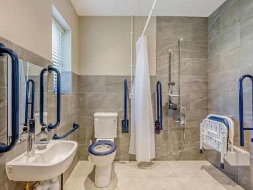 a bathroom with a toilet and a sink and a shower at 2 Bed in Kings Lynn oc-96048 in Middleton