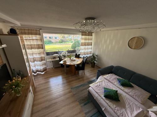 a living room with a couch and a table at Apartment Rita in Hannover