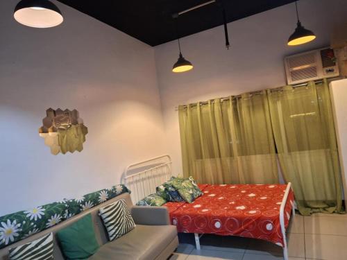 a living room with a couch and a table at JY7 Rooms 414 in Cebu City