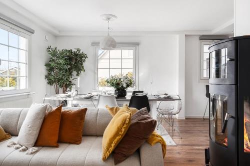 a living room with a couch and a table at Sunset Stay in Malmö