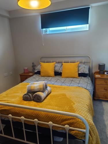 a bedroom with a bed with two towels on it at Tranquil Countryside Escape in Rural Kent- Pipistrelle View in Canterbury