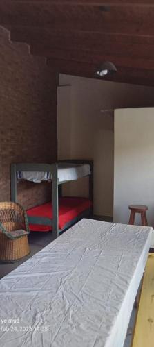 a bedroom with a bed and a bunk bed at Ye muá, ye tuá in City Bell