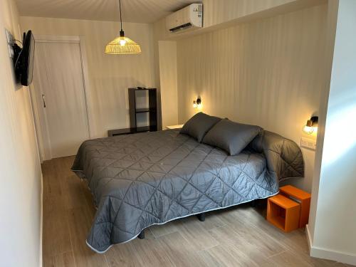 a bedroom with a bed in a room at Lorenzo in Benaguacil