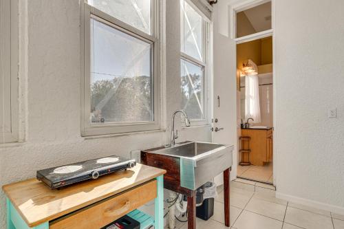 a kitchen with a sink and a window at Near Apollo Beach! Bright Apt w/ Essentials in Ruskin