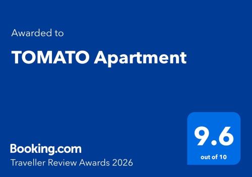 un cartello blu con la scritta appuntamento pomodoro di TOMATO Apartment a Kriva Palanka