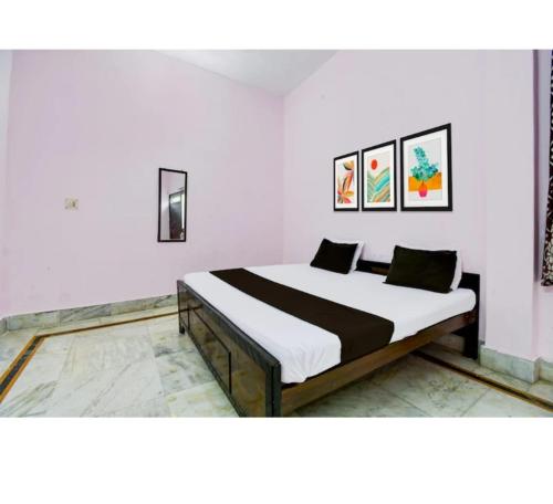 a bedroom with a bed in a room at Hotel Padamaa Palace in Varanasi