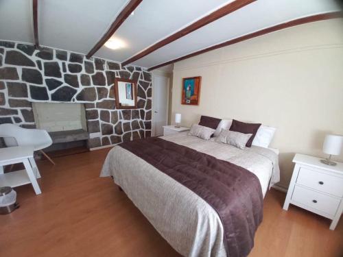 เตียงในห้องที่ Lodge Andes