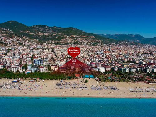 a view of a beach in front of a city at SA Apartments! Cleopatra Beach Duplex with Terrace in Alanya