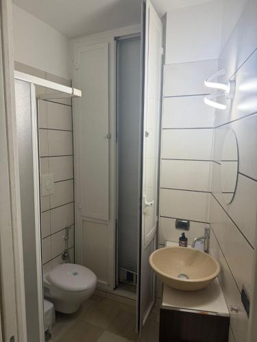 a bathroom with a sink and a toilet at Antica Dimora in Taranto