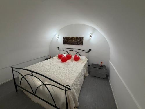 a bedroom with a bed with red balloons on it at Antica Dimora in Taranto