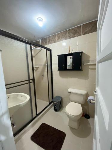 a bathroom with a toilet and a sink and a shower at Europa Ecotours in Jardin