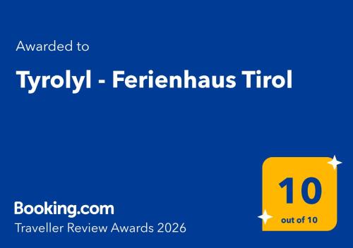 a yellow square with the words at Tyrolyl - Ferienhaus Tirol in Inzing
