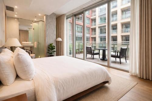 a bedroom with a large bed and a large window at Nester Finn Entertainment District in Toronto