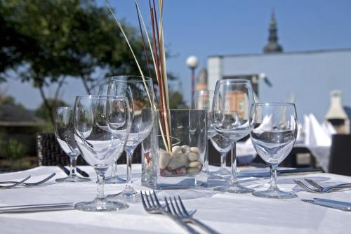 a group of wine glasses sitting on a table at Best Western Plaza Hotel Wels in Wels