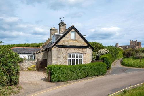 an old stone house on a street at 4 Bed in Bamburgh oc-gd1264 in Bamburgh