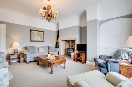 a living room with a couch and a table at 4 Bed in Bamburgh oc-gd1264 in Bamburgh