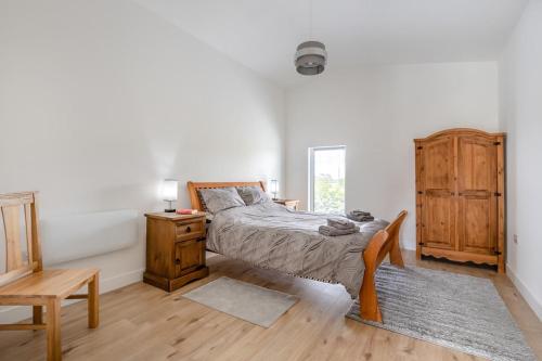 a bedroom with a bed and a desk and a chair at 2 Bed in Somerton oc-s32606 in Somerton