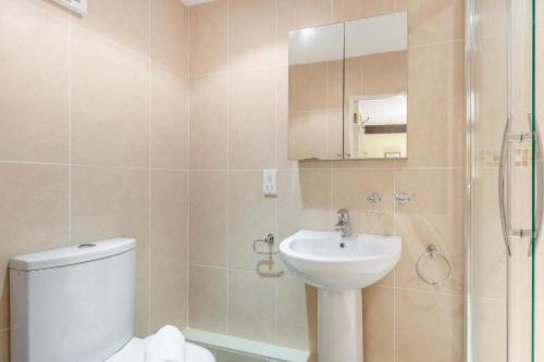 a bathroom with a toilet and a sink and a shower at 2 Bed in Low Row oc-ds1010 in Gunnerside