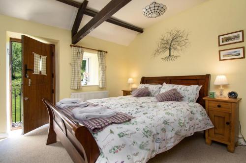 a bedroom with a large bed in a room at 2 Bed in Low Row oc-ds1010 in Gunnerside