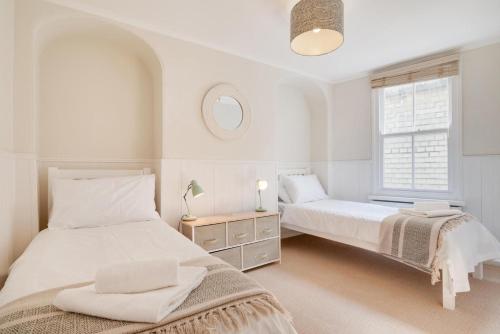 a bedroom with two beds and a window at 3 Bed in St. Ives oc-marhou in St Ives