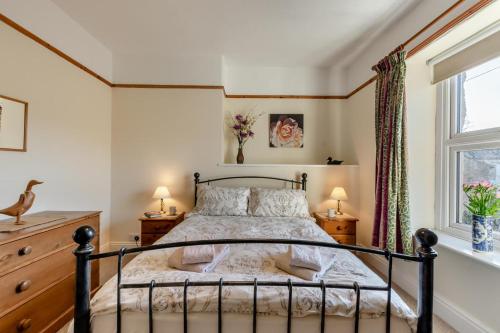 a bedroom with a bed and a window at 2 Bed in Ingleton oc-w31066 in Ingleton