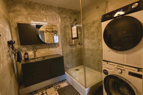 a bathroom with a shower and a washing machine at Private Room in Coliving - Paris 10min - by Cosynousvoici in Asnières-sur-Seine