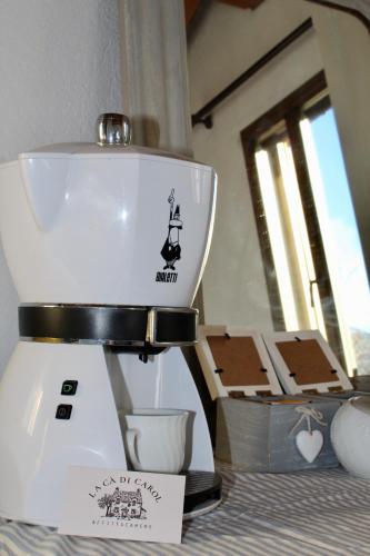 a white food processor sitting on top of a counter at La Cà di Carol in Tollegno