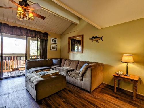 a living room with a couch and a table at Snow Summit Townhouse Unit 69 in Big Bear Lake